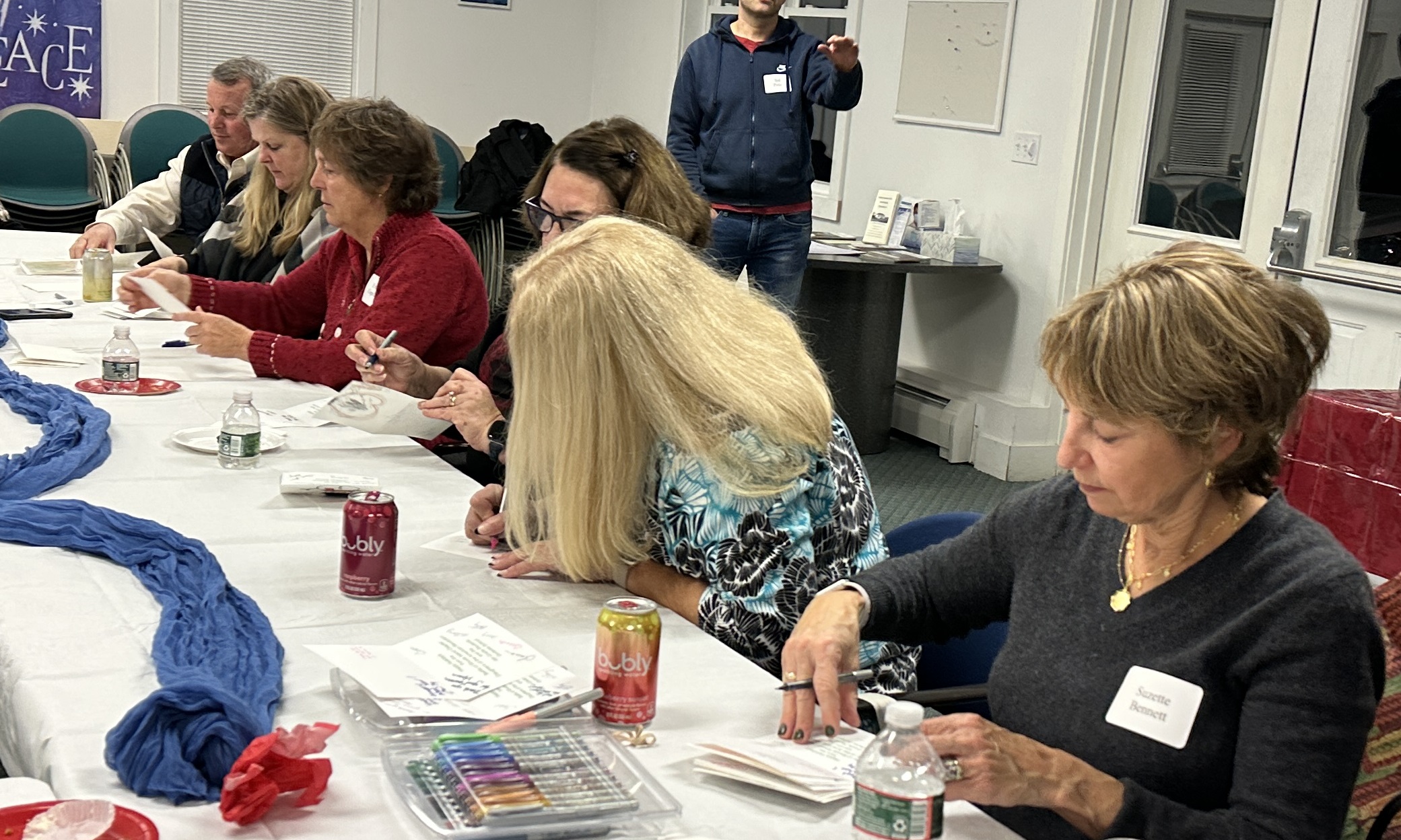 Chapter Members signing holiday cards for veterans